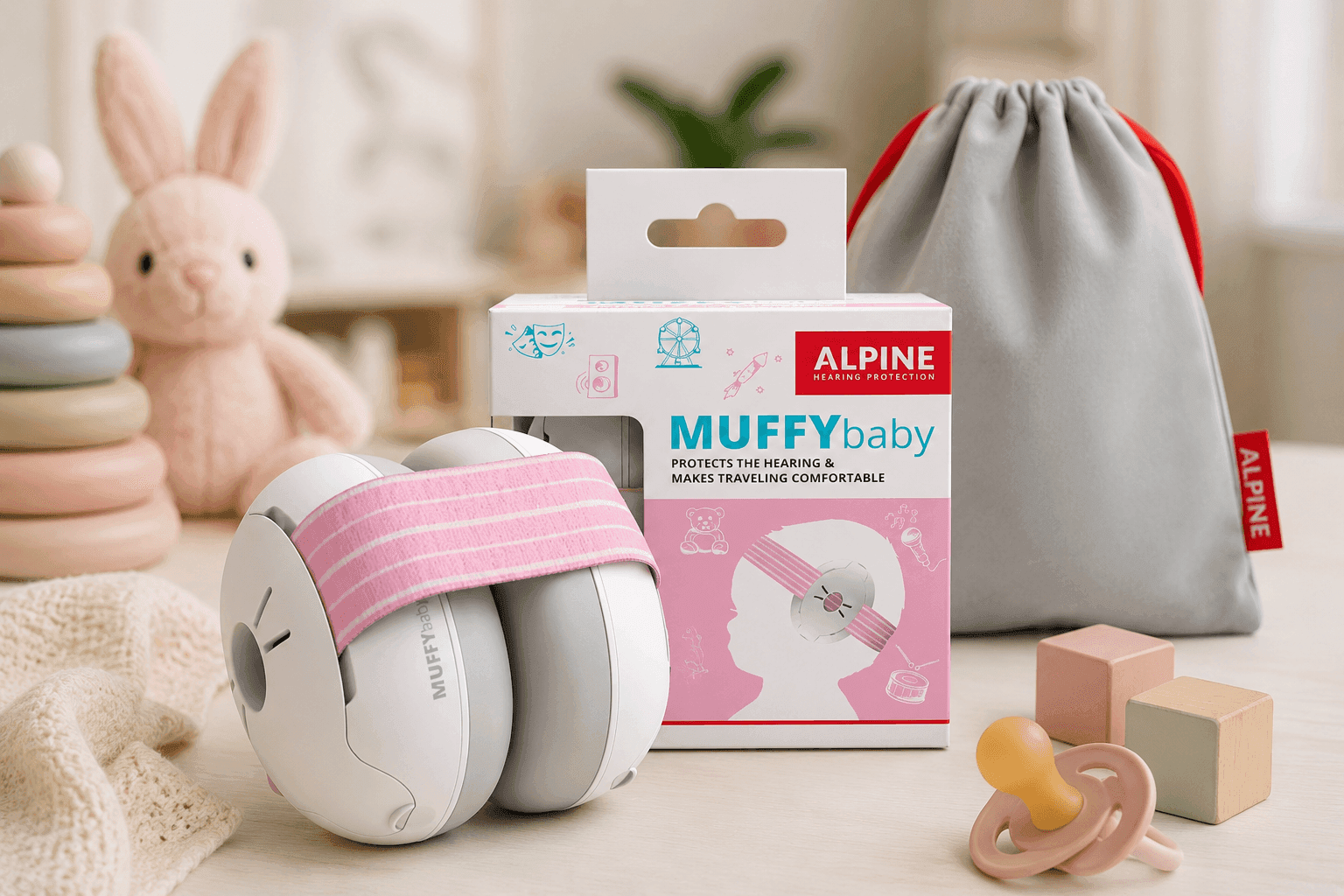 Alpine Muffy Baby Ear Protection on infant during airplane travel for noise reduction and hearing safety