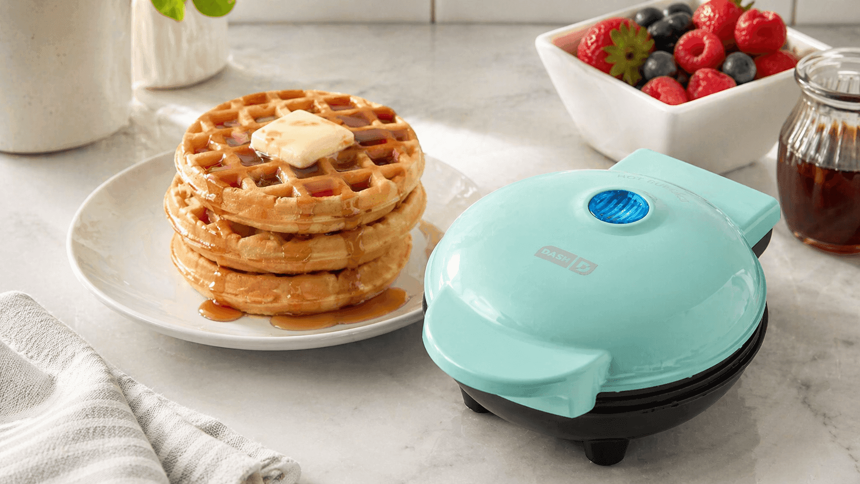 Dash Mini Waffle Maker open showing perfectly cooked mini waffle